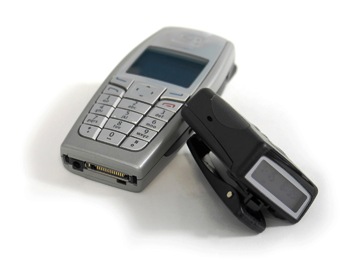 Featured is a photo of a pager and cell phone.